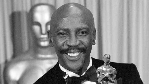 FILE - Louis Gossett Jr., poses with the Oscar for best supporting actor for his role in "An Officer and a Gentleman," at the annual Academy Awards presentation in Los Angeles on April 11, 1983. Gossett Jr., the first Black man to win a supporting actor Oscar and an Emmy winner for his role in the seminal TV miniseries 