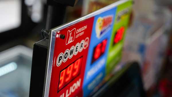 A sign for the Powerball jackpot is displayed at a 7-Eleven, Friday, April 5, 2024, in Portland, Ore. (AP Photo/Jenny Kane)