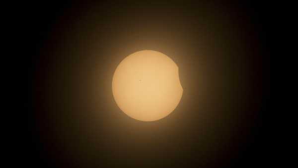 The moon partially covers the sun during a total solar eclipse in Mazatlan, Mexico, Monday, April 8, 2024. (AP Photo/Fernando Llano)