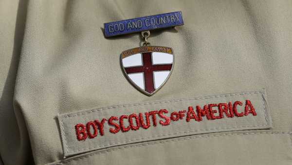 FILE - A close up of a Boy Scout uniform is photographed on Feb. 4, 2013, in Irving, Texas. Ohio victims of child sexual abuse while in the Boy Scouts of America will see more compensation for the crimes committed against them after Republican Gov. Mike DeWine signed a new law guaranteeing it Thursday, Oct. 12, 2023. (AP Photo/Tony Gutierrez, File)