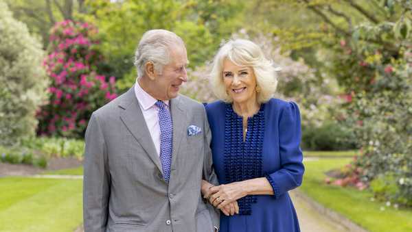 King Charles III and Queen Camilla stand in Buckingham Palace Gardens on Wednesday, April 10, 2024, the day after their 19th wedding anniversary.