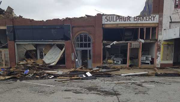 A row of buildings is left damaged by a tornado in Sulphur, Okla., Sunday, April 28, 2024.