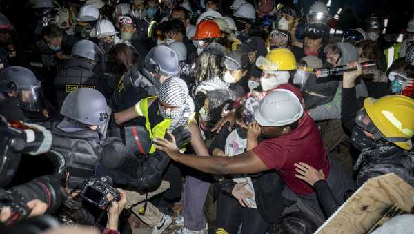 Police advance on pro-Palestinian demonstrators on the UCLA campus Thursday, May 2, 2024, in Los Angeles. (AP Photo/Ethan Swope)