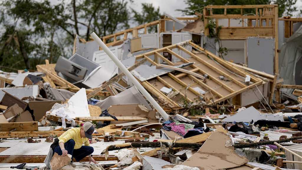 Storm-battered South is again under threat; boy swept into a drain ...