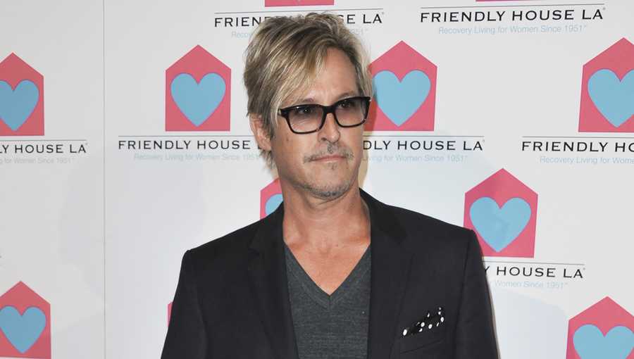 FILE - Charlie Colin appears at the Friendly House Los Angeles&apos; 24th Annual Awards Luncheon on Oct. 26, 2013 in Los Angeles. Colin, bassist and founding member of the American pop-rock band Train, best known for their early-aughts hits like “Drops of Jupiter&quot; and “Meet Virginia,” has died. He was 58. (Photo by Richard Shotwell/Invision/AP, File)
