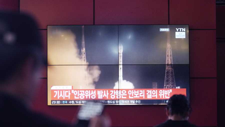 A TV screen shows a file image of North Korea&apos;s rocket launch during a news program at a bus terminal in Seoul, South Korea, Monday, May 27, 2024. North Korea on Monday, May 27, 2024, launched a missile into the sea, Japan and South Korea said, hours after North Korea announced plans to put a rocket into orbit apparently carrying its second military reconnaissance satellite. (AP Photo/Ahn Young-joon)