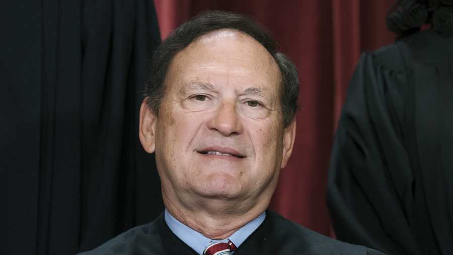 FILE - Associate Justice Samuel Alito joins other members of the Supreme Court as they pose for a new group portrait, Oct. 7, 2022, at the Supreme Court building in Washington. Alito rejects calls to step aside from Supreme Court cases on Trump and Jan. 6. (AP Photo/J. Scott Applewhite, File)