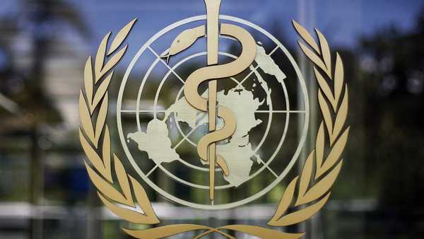 FILE - The logo of the World Health Organization is seen at the WHO headquarters in Geneva, Switzerland, June 11, 2019. A death in Mexico was caused by a strain of bird flu that has never before been found in a human, the World Health Organization said Wednesday. (AP Photo/Anja Niedringhaus, File)