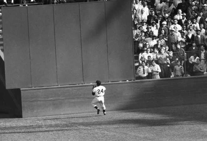 FILE&#x20;-&#x20;New&#x20;York&#x20;Giants&amp;apos&#x3B;&#x20;Willie&#x20;Mays&#x20;makes&#x20;a&#x20;catch&#x20;of&#x20;a&#x20;ball&#x20;hit&#x20;by&#x20;Cleveland&#x20;Indians&amp;apos&#x3B;&#x20;Vic&#x20;Wertz&#x20;in&#x20;Game&#x20;1&#x20;of&#x20;the&#x20;1954&#x20;baseball&#x20;World&#x20;Series&#x20;in&#x20;New&#x20;York&amp;apos&#x3B;s&#x20;Polo&#x20;Grounds&#x20;on&#x20;Sept.&#x20;29,&#x20;1954.&#x20;Mays,&#x20;the&#x20;electrifying&#x20;&#x201C;Say&#x20;Hey&#x20;Kid&#x201D;&#x20;whose&#x20;singular&#x20;combination&#x20;of&#x20;talent,&#x20;drive&#x20;and&#x20;exuberance&#x20;made&#x20;him&#x20;one&#x20;of&#x20;baseball&#x2019;s&#x20;greatest&#x20;and&#x20;most&#x20;beloved&#x20;players,&#x20;has&#x20;died.&#x20;He&#x20;was&#x20;93.&#x20;Mays&amp;apos&#x3B;&#x20;family&#x20;and&#x20;the&#x20;San&#x20;Francisco&#x20;Giants&#x20;jointly&#x20;announced&#x20;Tuesday&#x20;night,&#x20;June&#x20;18,&#x20;2024,&#x20;he&#x20;had&#x20;&#x201C;passed&#x20;away&#x20;peacefully&#x201D;&#x20;Tuesday&#x20;afternoon&#x20;surrounded&#x20;by&#x20;loved&#x20;ones.&#x20;&#x28;AP&#x20;Photo,&#x20;File&#x29;