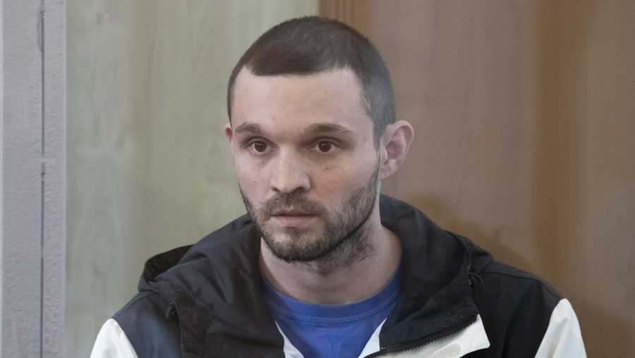 U.S. Army Staff Sgt. Gordon Black sits in a glass cage in courtroom in Vladivostok, Russia, on Wednesday, June 19, 2024.