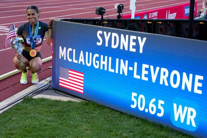 Sydney&#x20;McLaughlin-Levrone&#x20;poses&#x20;for&#x20;a&#x20;photo&#x20;after&#x20;winning&#x20;the&#x20;women&#x27;s&#x20;400-meter&#x20;hurdles&#x20;final&#x20;during&#x20;the&#x20;U.S.&#x20;Track&#x20;and&#x20;Field&#x20;Olympic&#x20;Team&#x20;Trials,&#x20;Sunday,&#x20;June&#x20;30,&#x20;2024,&#x20;in&#x20;Eugene,&#x20;Ore.&#x20;&#x28;AP&#x20;Photo&#x2F;Charlie&#x20;Neibergall&#x29;