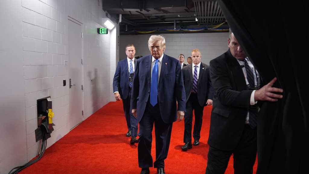 Former President Donald Trump was separated from supporters by his Secret Service element as he walked onto the ground of the Republican Nationwide Conference Tuesday night time