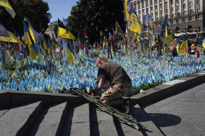 A&#x20;veteran&#x20;pays&#x20;his&#x20;respect&#x20;at&#x20;a&#x20;makeshift&#x20;memorial&#x20;for&#x20;fallen&#x20;Ukrainian&#x20;soldiers&#x20;during&#x20;the&#x20;Ukrainian&#x20;Independence&#x20;Day&#x20;on&#x20;Independence&#x20;Square&#x20;in&#x20;Kyiv,&#x20;Ukraine,&#x20;Saturday,&#x20;Aug.&#x20;24,&#x20;2024.&#x20;&#x28;AP&#x20;Photo&#x2F;Efrem&#x20;Lukatsky&#x29;