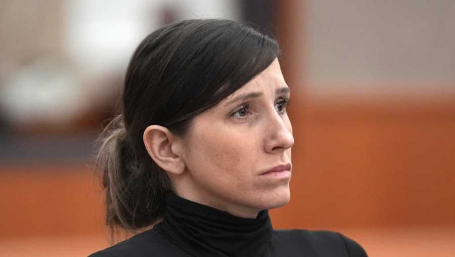 FILE - Kouri Richins, a Utah mother of three, who wrote a children's book about coping with grief after her husband's death and was later accused of fatally poisoning him, looks on during a hearing, May 15, 2024, in Park City, Utah.