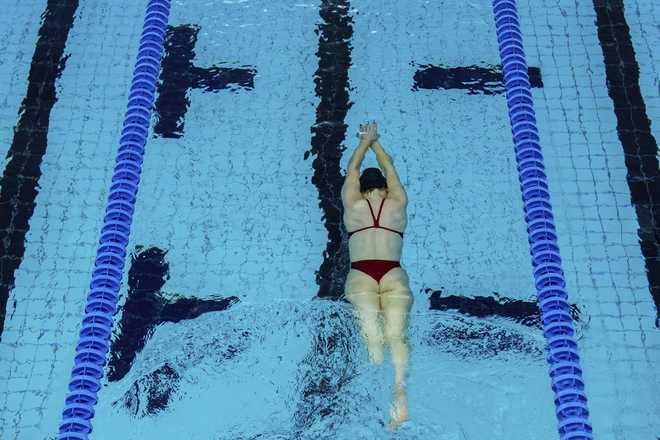 Paralympic swimmer Ali Truwit practices at Chelsea Piers Athletic Club, Friday, Aug. 2, 2024, in Stamford, Conn. (AP Photo/Julia Nikhinson)