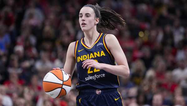 Indiana Fever guard Caitlin Clark (22) plays against the Los Angeles Sparks in the second half of a WNBA basketball game in Indianapolis, Wednesday, Sept. 4, 2024. (AP Photo/Michael Conroy)