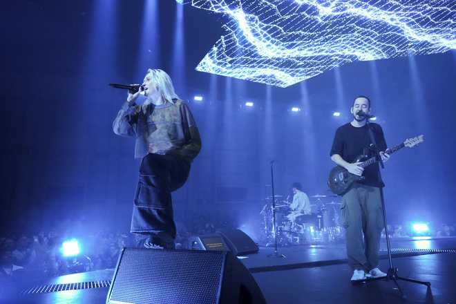 Emily&#x20;Armstrong,&#x20;from&#x20;left,&#x20;Colin&#x20;Brittain,&#x20;and&#x20;Mike&#x20;Shinoda&#x20;of&#x20;Linkin&#x20;Park&#x20;perform&#x20;Thursday,&#x20;Sept.&#x20;5,&#x20;2024,&#x20;in&#x20;Los&#x20;Angeles.&#x20;It&#x20;was&#x20;announced&#x20;on&#x20;Thursday&#x20;that&#x20;Dead&#x20;Sara&amp;apos&#x3B;s&#x20;Emily&#x20;Armstrong&#x20;would&#x20;join&#x20;as&#x20;the&#x20;band&amp;apos&#x3B;s&#x20;new&#x20;co-singer&#x20;and&#x20;songwriter&#x2F;producer&#x20;Colin&#x20;Brittain&#x20;would&#x20;join&#x20;on&#x20;drums.&#x20;Linkin&#x20;Park&#x20;will&#x20;release&#x20;the&#x20;album&#x20;&amp;quot&#x3B;From&#x20;Zero&amp;quot&#x3B;&#x20;on&#x20;Nov.&#x20;15,&#x20;marking&#x20;their&#x20;first&#x20;new&#x20;record&#x20;since&#x20;former&#x20;frontman&#x20;Chester&#x20;Bennington&#x20;died&#x20;in&#x20;2017.&#x20;&#x28;Photo&#x20;by&#x20;Jordan&#x20;Strauss&#x2F;Invision&#x2F;AP