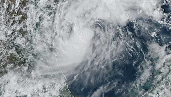 This GOES-16 GeoColor satellite image taken at 4:50 p.m. EDT and provided by National Oceanic and Atmospheric Administration (NOAA) shows Tropical Storm Milton, center, off the coast of Mexico in the Gulf of Mexico, Saturday, Oct. 5, 2024. (NOAA via AP)