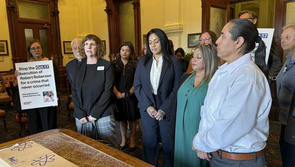 Elizabeth Ramirez, center, Casandra Rivera, center right, and Anna Vasquez, second from right, of the "San Antonio 4" group, deliver boxes with petitions in the Texas State capitol for Texas Gov. Greg Abbott seeking the pardoning of Robert Roberson's execution, Wednesday, Oct. 16, 2024, in Austin, Texas. Roberson, 57, is scheduled to receive a lethal injection on Oct. 17, for the 2002 killing of his 2-year-old daughter, Nikki Curtis, in the East Texas city of Palestine. Roberson has long proclaimed his innocence. (AP Photo/Nadia Lathan)