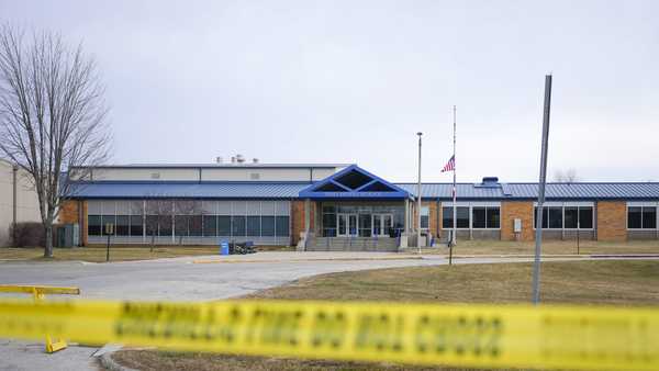 Tape blocks all entrances at the Perry Middle School and High School building on Friday, Jan. 5, 2024, in Perry, Iowa. A day after a shooting sent bullets flying inside the small-town Iowa high school, leaving a sixth grader dead and others wounded, the community of Perry is somber.   (AP Photo/Bryon Houlgrave)