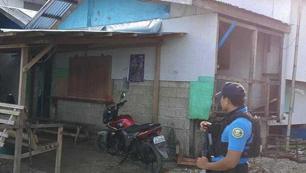 In this photo provided by the Philippine National Police Regional Office 9, a policeman checks an area Friday Oct. 18, 2024, where an American identified as Elliot Onil Eastman, from Vermont, was reportedly abducted by gunmen in Sibuco town, Zamboanga del Norte province, southern Philippines. (Philippine National Police Regional Office 9 via AP)