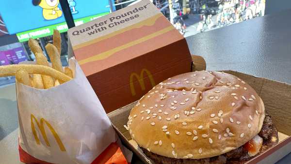 A McDonald's Quarter Pounder hamburger and fries are shown in this photograph, in New York's Times Square, Wednesday, Oct. 23, 2024.