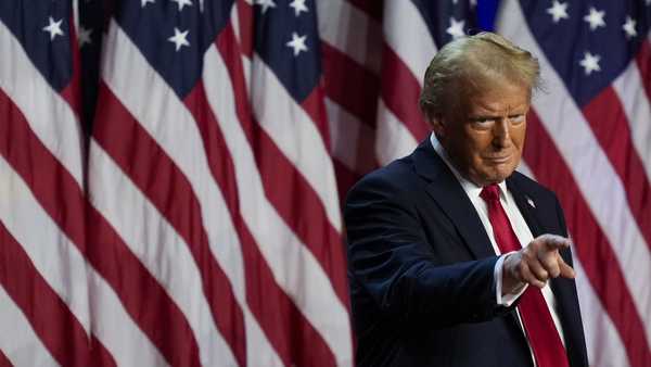 Republican presidential nominee former President Donald Trump points to the crowd at an election night watch party, Wednesday, Nov. 6, 2024, in West Palm Beach, Fla.