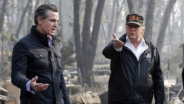 FILE - President Donald Trump talks with then California Gov.-elect Gavin Newsom, left, during a visit to a neighborhood impacted by the wildfires in Paradise, Calif., Nov. 17, 2018. (AP Photo/Evan Vucci, File)