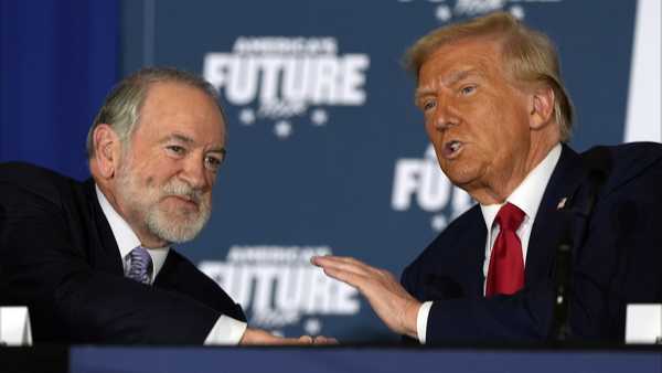 Republican presidential nominee former President Donald Trump talks with former Arkansas Gov. Mike Huckabee during a roundtable at the Drexelbrook Catering & Event Center, Tuesday, Oct. 29, 2024, in Drexel Hill, Pa. (AP Photo/Julia Demaree Nikhinson)