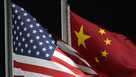 FILE - The American and Chinese flags wave at Genting Snow Park, Feb. 2, 2022, in Zhangjiakou, China.