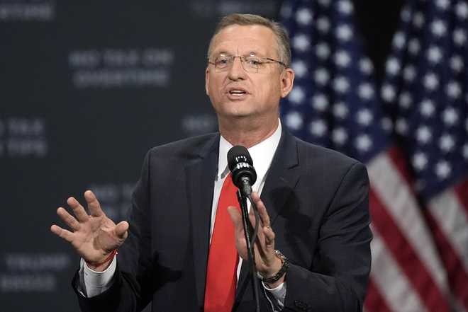 Former Rep. Doug Collins speaks before Republican presidential nominee former President Donald Trump at a campaign event at the Cobb Energy Performing Arts Centre, Tuesday, Oct. 15, 2024, in Atlanta. (AP Photo/John Bazemore)