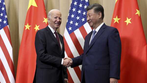 President Joe Biden shakes hands with Chinese President Xi Jinping before a bilateral meeting, Saturday, Nov. 16, 2024, in Lima, Peru. (Leah Millis/Pool Photo via AP)