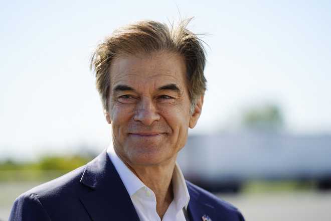 FILE - Mehmet Oz visits the AW Driving School &amp; License Testing Center in Allentown, Pa., Sept. 23, 2022. (AP Photo/Matt Rourke, File)