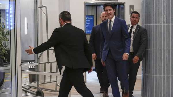 Canadian Prime Minister Justin Trudeau walks through the lobby of the Delta Hotel by Marriott, Friday, Nov. 29, 2024, in West Palm Beach, Fla. (AP Photo/Carolyn Kaster)