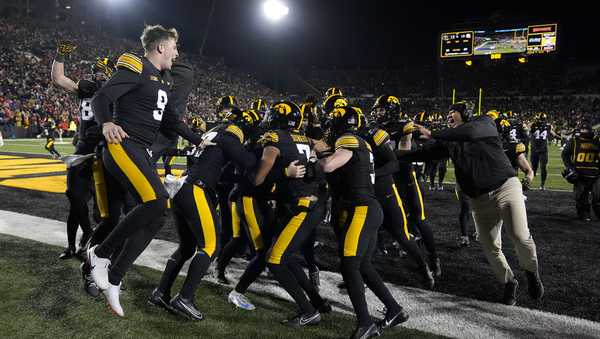 Iowa players celebrate after an NCAA college football game against Nebraska, Friday, Nov. 29, 2024, in Iowa City, Iowa. (AP Photo/Charlie Neibergall)