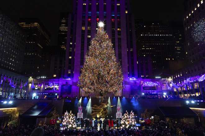 The Rockefeller Center Christmas tree is lit during the 92nd Annual Rockefeller Center Christmas Tree Lighting Ceremony on Wednesday, December 4, 2024, in New York. (AP Photo/Julia Demaree Nikhinson)