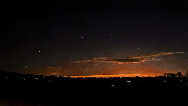 This photo provided by Trisha Bushey shows the evening sky and points of light near in Lebanon Township, N.J., on Thursday, Dec. 5, 2024. (Trisha Bushey via AP)