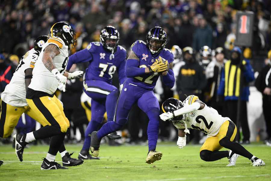 Baltimore Ravens running back Derrick Henry (22) runs with the ball against the Pittsburgh Steelers during the second half of an NFL football game, Saturday, Dec. 21, 2024, in Baltimore. (AP Photo/Nick Wass)