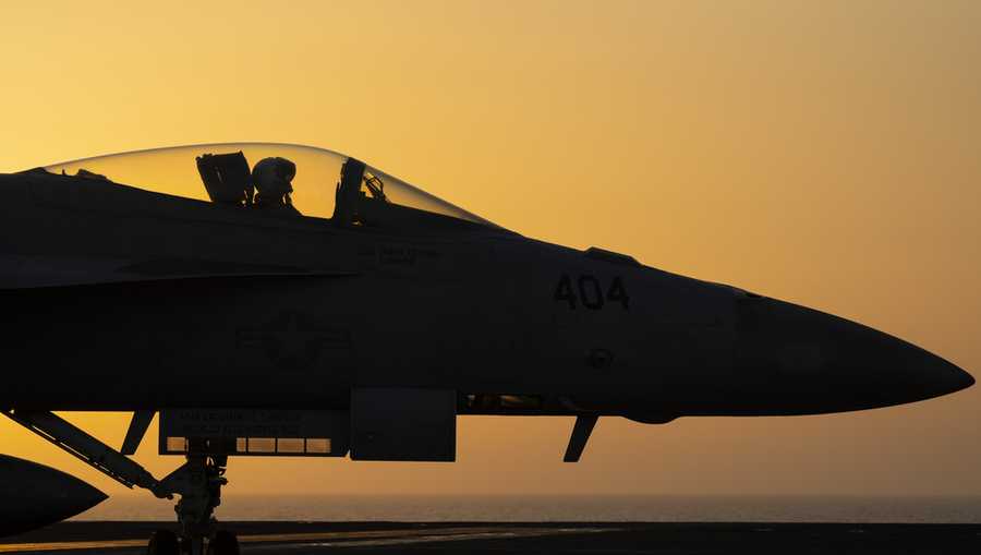 FILE - A fighter jet maneuvers on the deck of the USS Dwight D. Eisenhower in the Red Sea, June 11, 2024. (AP Photo/Bernat Armangue, File)