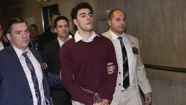 Luigi Mangione is escorted into Manhattan Criminal court for his arraignment on state murder and terror charges in the killing of UnitedHealthcare CEO Brian Thompson, Monday, Dec. 23, 2024, in New York. (AP Photo/Seth Wenig)