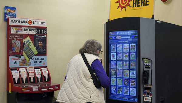 A person makes their lottery ticket selections on a self-serve terminal inside a gas station ahead of Friday's Mega Millions drawing of $1.15 billion, Thursday, Dec. 26, 2024, in Baltimore. (AP Photo/Stephanie Scarbrough)