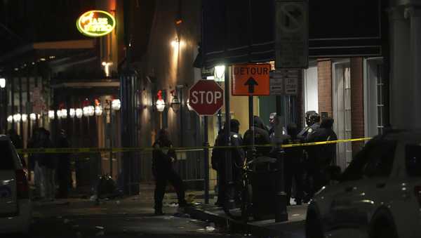 Emergency services attend the scene after a vehicle drove into a crowd on New Orleans' Canal and Bourbon Street, Wednesday Jan. 1, 2025.