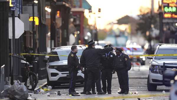 Security personnel gather at the scene on Bourbon Street after a vehicle drove into a crowd on New Orleans' Canal and Bourbon Street, Wednesday Jan. 1, 2025.