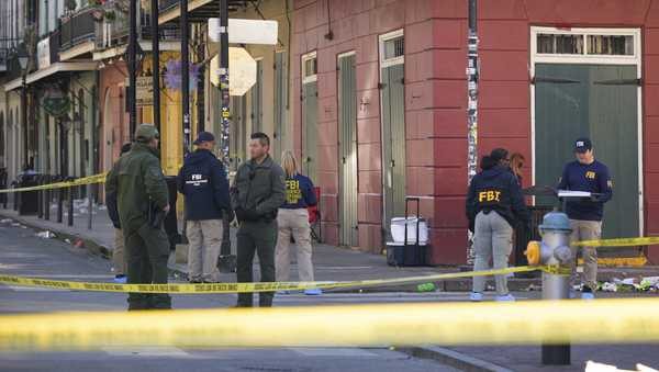 The FBI investigates the area on Orleans St and Bourbon Street by St. Louis Cathedral in the French Quarter where a suspicious package was detonated after a person drove a truck into a crowd earlier on Bourbon Street on Wednesday, Jan. 1, 2025. (AP Photo/Matthew Hinton)