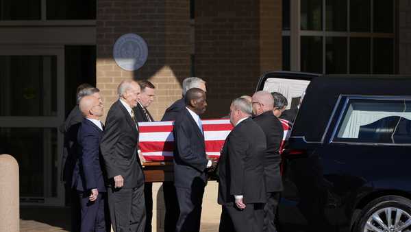 Former and current U.S. Secret Service agents assigned to the Carter detail, move the flag-draped casket of former President Jimmy Carter, at Phoebe Sumter Medical Center in Americus, Ga., Saturday, Jan. 4, 2025. Carter died Dec. 29 at the age of 100. (AP Photo/Alex Brandon, Pool)