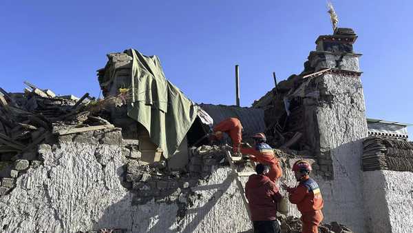 In this photo released by Xinhua News Agency, rescue workers search for survivors in the aftermath of an earthquake in Changsuo Township of Dingri in Xigaze, southwestern China's Tibet Autonomous Region on Tuesday, Jan. 7, 2025.