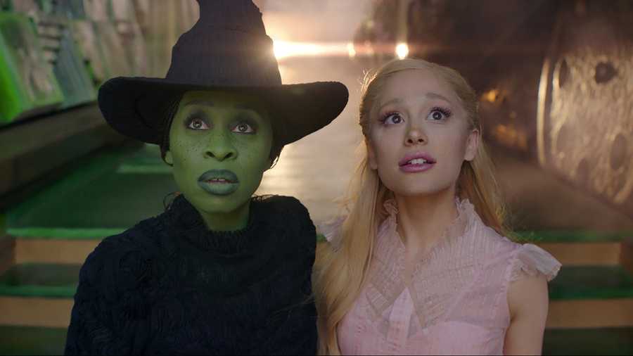 This image released by Universal Pictures shows Cynthia Erivo, left, and Ariana Grande in a scene from the film &quot;Wicked.&quot; (Universal Pictures via AP)