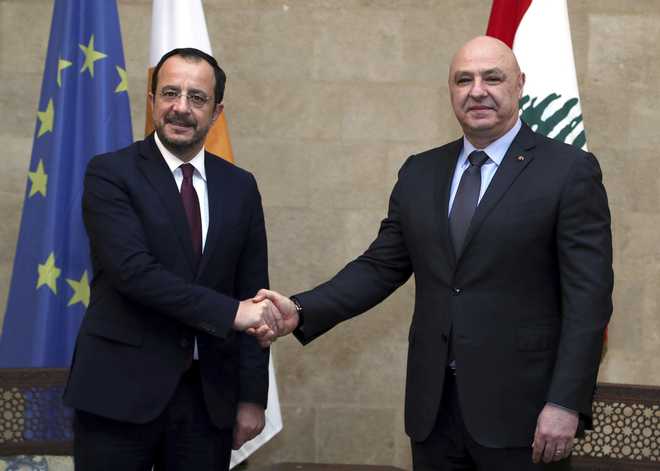 In this photo released by the Lebanese Presidency press office, Lebanese President Joseph Aoun, right, shakes hands with his Cypriot counterpart Nikos Christodoulides, at the presidential palace in Baabda, east of Beirut, Lebanon, Friday, Jan. 10, 2025. (Lebanese Presidency press office via AP)