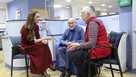Britain's Princess Kate, left, talks with Richard Bosworth, centre, during a visit to The Royal Marsden Hospital, where she received her cancer treatment, in London, Tuesday Jan. 14, 2025 in London, England.
