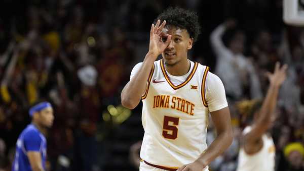 Iowa State guard Curtis Jones celebrates after making a three-point basket during the first half of an NCAA college basketball game against Kansas Wednesday, Jan. 15, 2025, in Ames, Iowa. (AP Photo/Charlie Neibergall)